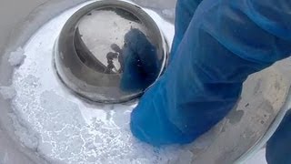 Figure C. A shiny hemispherical block of mercury.