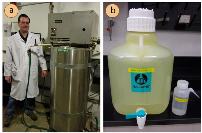 A: Lab worker stands by large industrial distiller. The aluminum tank, labelled "distilled water", is approximately the same size as the worker. B: Carboy with spigot labelled "distilled water". Next to it is a small plastic bottle of distilled water.