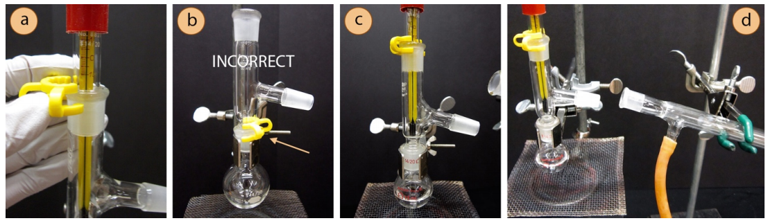  A: Plastic clip being secured to the thermometer adapter. B: Plastic clip secured to distilling flask, labelled incorrect. C: Distilling flask with thermometer attached, plastic clip attached to the joint of the thermometer adapter. D: Condenser being held up to thermometer adapter, about to be attached.