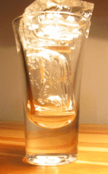Gif of melting ice cubes in a glass.