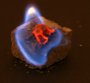 Cube of table sugar burning.