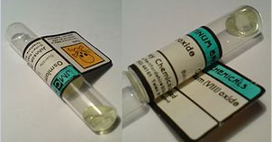 Two images of a vial with clear liquid with a yellow tint. On left, the vial's label clearly shows a hazard symbol. On right, the vial's label indicates that the liquid is Osmium 3 Oxide. 