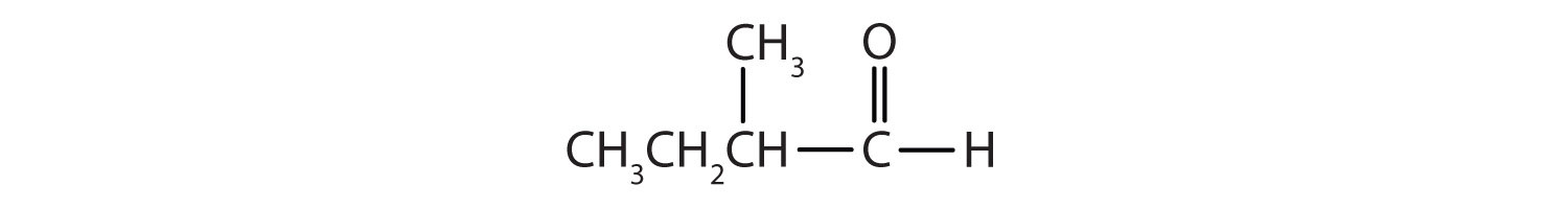 Un carbono carbonilo está unido a 1 átomo de H y a un grupo 1 metilpropilo.