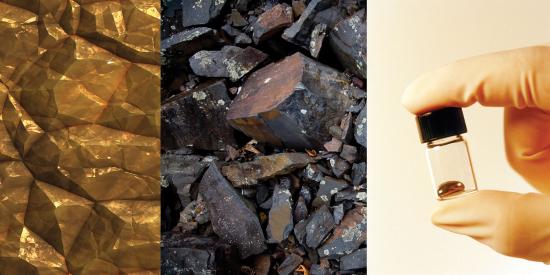 gold rock like formations, gray rock like formations and a silver liquid drop in a small glass bottle