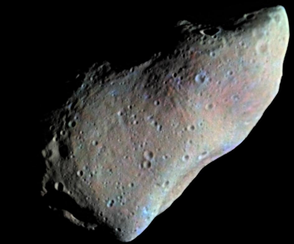 Image of Asteroid-951 Gaspra shows multitudes of small craters and large flat areas.
