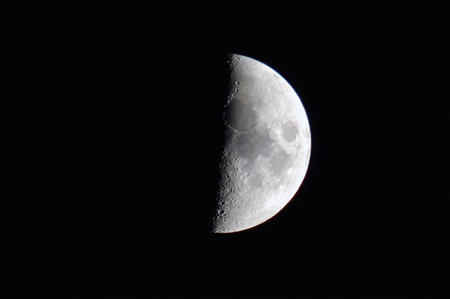 Image of a first quarter moon.