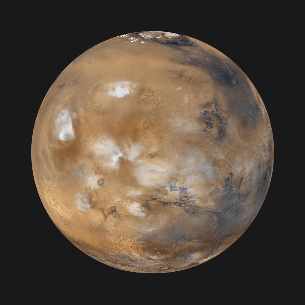Image of Mars – note the polar cap (top), clouds.