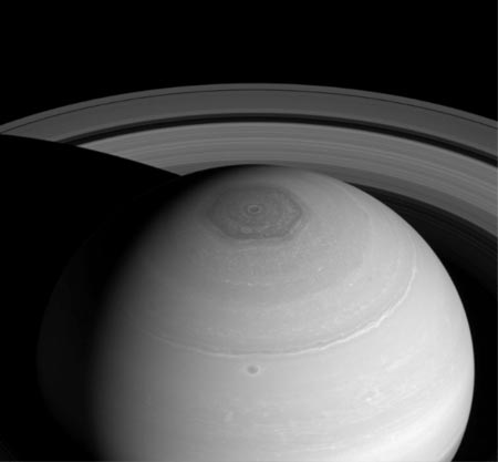 Image of Black and white image of Saturn’s odd six sided Polar Hexagon.