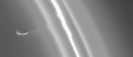 Image of Saturn’s F ring, with the moon Prometheus pulling material from the ring.