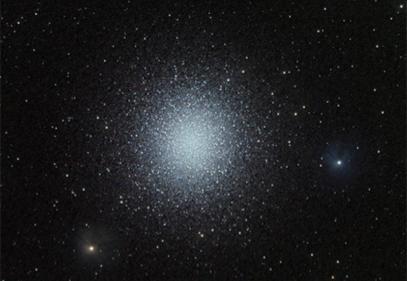 Globular Cluster in Hercules, M13; tight grouping of stars, spherical in shape.