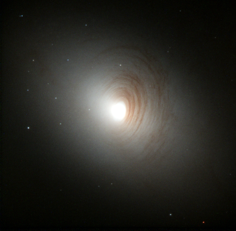 Image of NGC 2787, Lenticular Spiral galaxy is disk-shaped with no spiral arms.