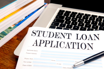 A student loan application, laying on a computer keyboard