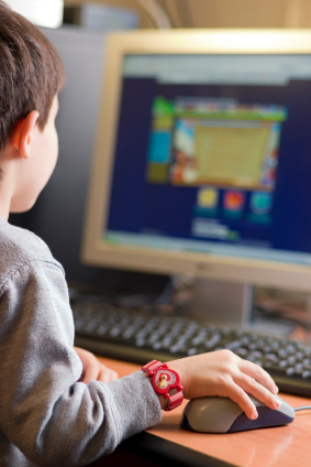 A young child using a computer to browse the Internet