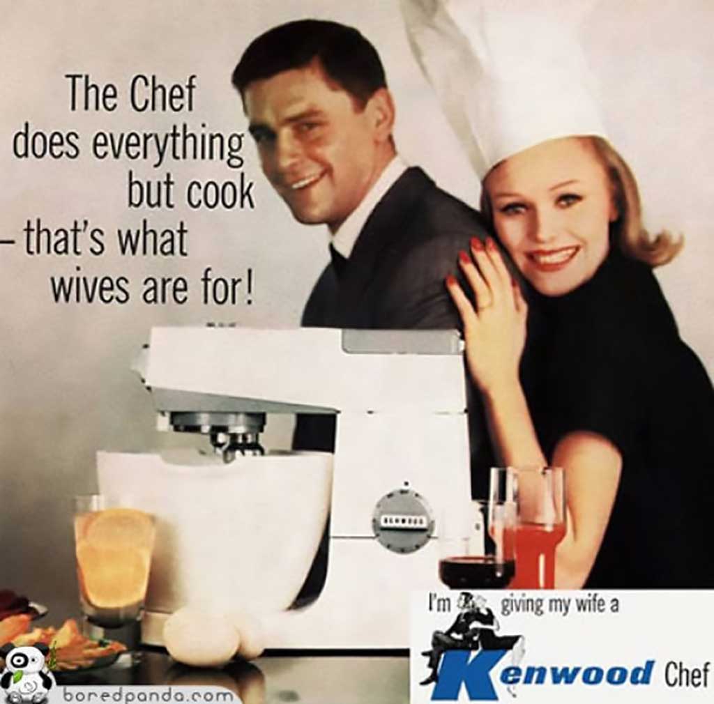 A print advertisement for a Kenwood electrical kitchen mixer. The image features a man in a business suit with a woman—ostensibly his wife—embracing him from behind. They are posing behind a white kitchen mixer and some assorted food items. She is wearing a chef's hat and is beaming at the camera. The advertisement includes text that reads â€˜The Chef does everything but cook—that's what wives are for!' In the lower right-hand corner of the advertisement, the text reads â€˜I'm giving my wife a Kenwood Chef.'