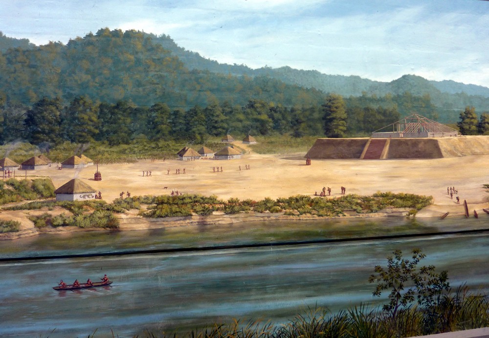 A painting of a Mesoamerican village by a river.
