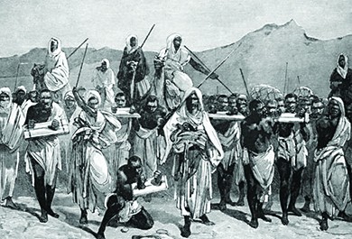 An illustration shows traders transporting a group of slaves, who are connected at the neck and bound at the wrists.