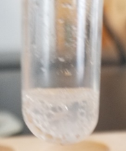 calcium carbonate and barium carbonate dissolve by reacting with acetic acid with evolution of carbon dioxide