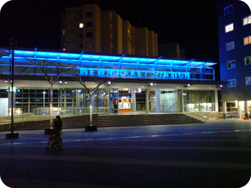 Blue neon lights on a subway station
