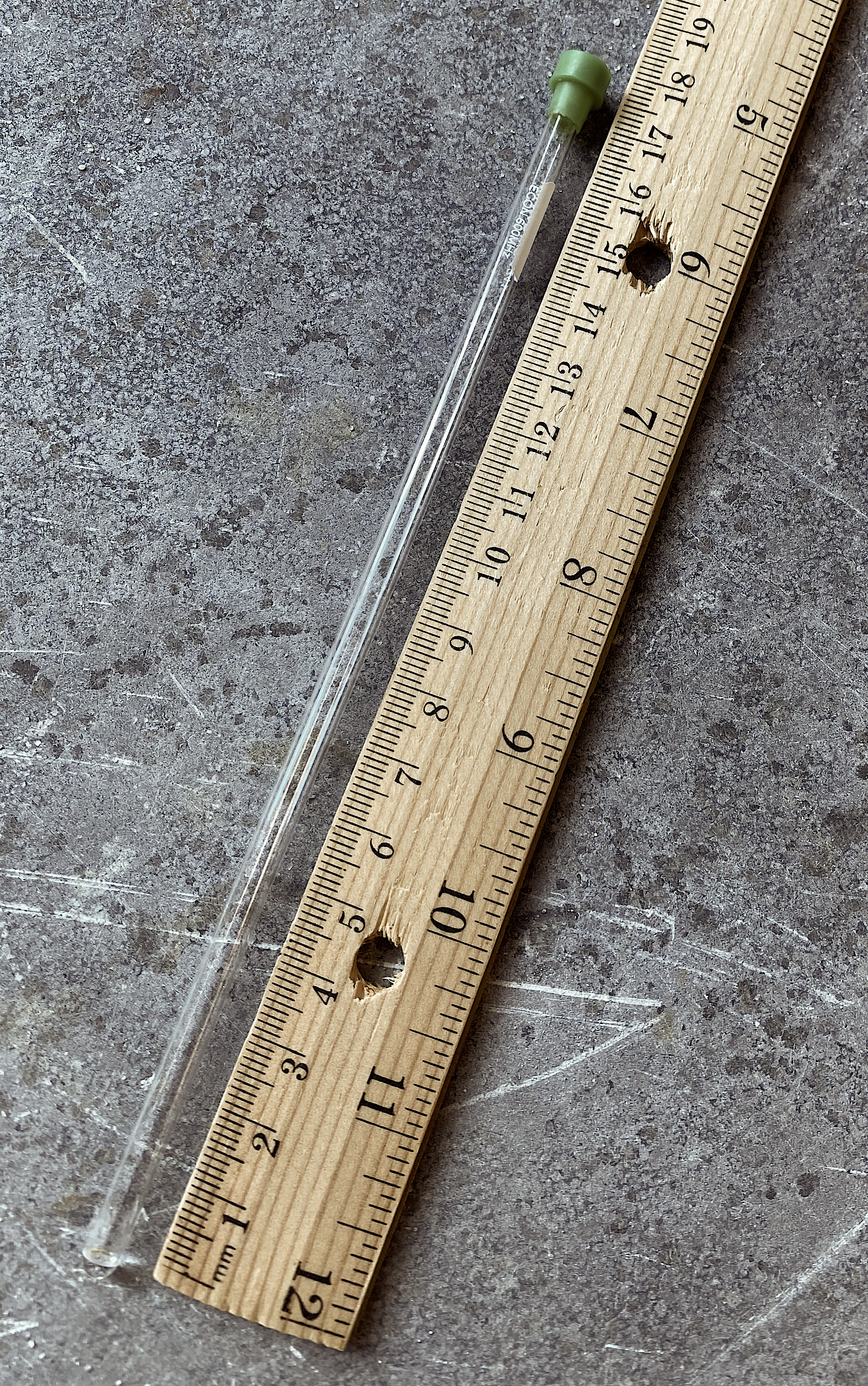 Photographs showing an NMR sample tube (left) and the spinner assembly (right).