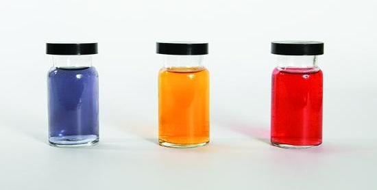 This figure shows three containers filled with liquids of different colors. The first appears to be purple, the second, orange, and the third red.