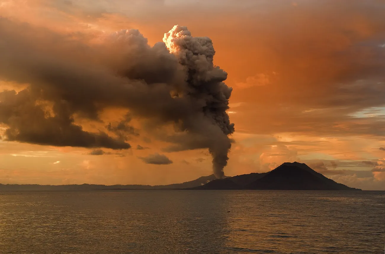 A volcanic eruption causing the release of gases.