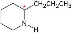 The structure of coniine, in which N is in first position. C2 is labeled with asterisk and bonded to a propyl group.