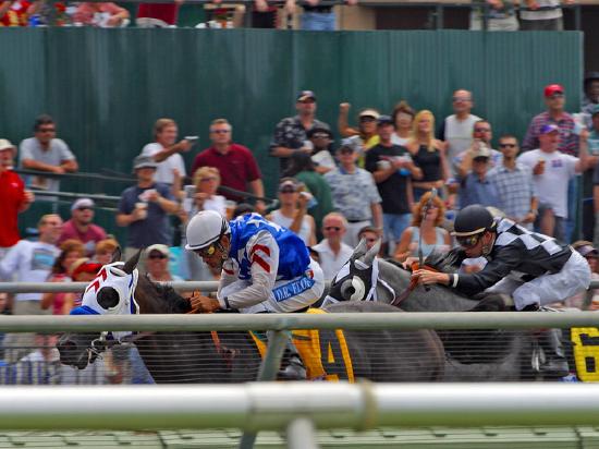 A picture of jockeys riding horses in a race