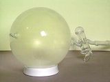Image of a glass ball of chlorine gas.