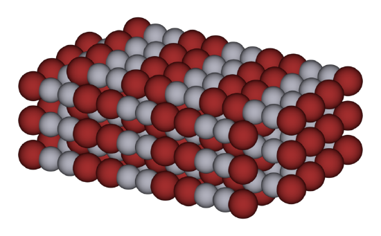 Tightly packed red and white spheres make up a cuboid structure. 