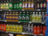 Image of the soft drink shelf in a grocery store.