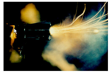 Picture of bullet being shot from a gun. Vapor and trails of bright light emerge from the gun.  