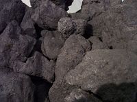 Black and ashy rocks.