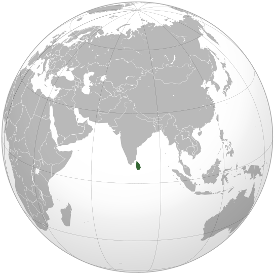 Diagram of a globe with area of Sri Lanka in color and all other areas in grey. 