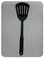 Black slotted spatula with a long handle placed on a light gray background.