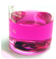 A beaker containing a pink liquid with measurement markings on the side.